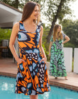 Orange Butterfly Print Sleeveless Pleated Knee Length Pocket Dress