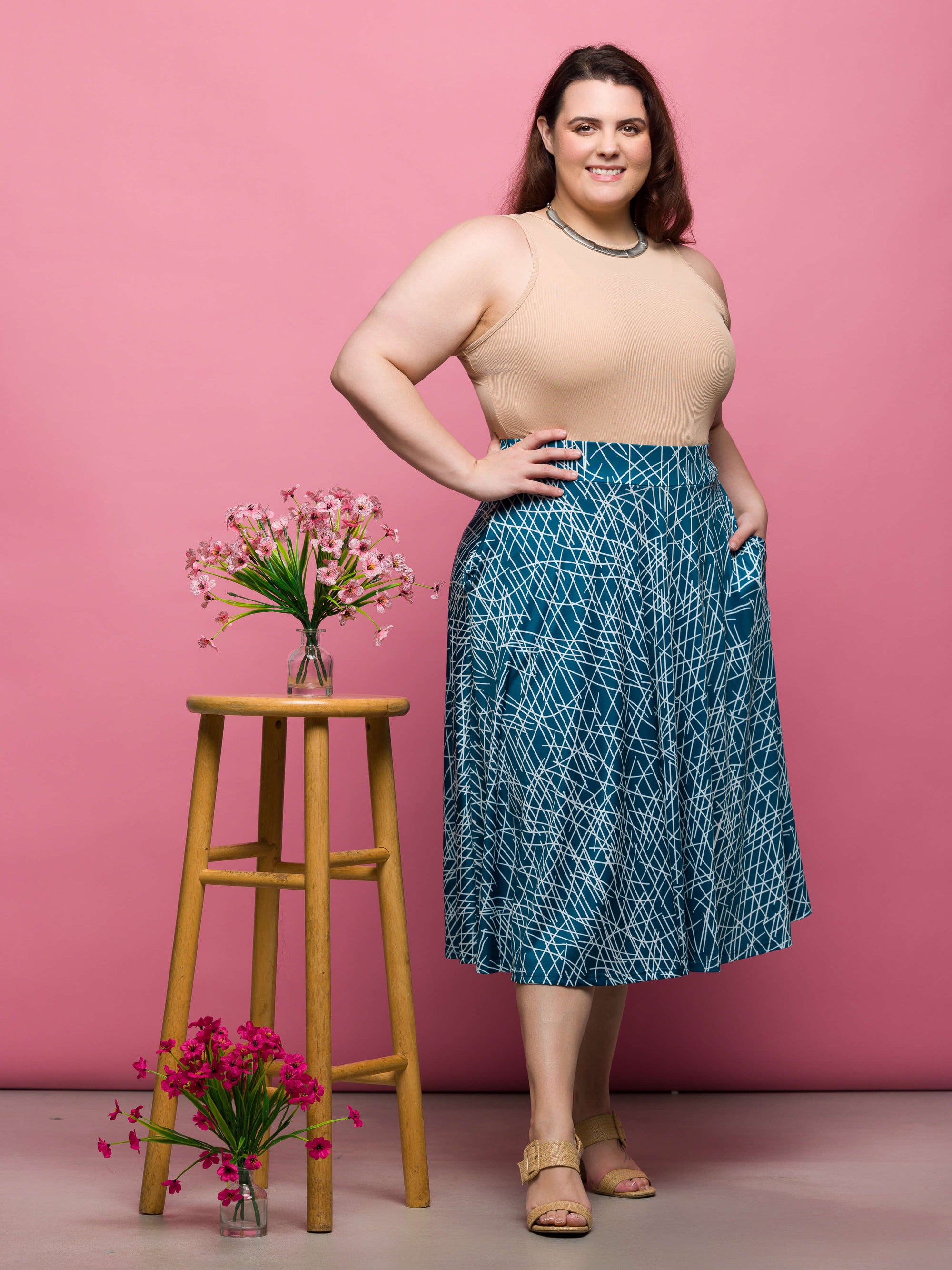 24seven Comfort Apparel Plus Size Teal Geometric Print Elastic Waist Pocket Midi Skirt