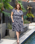 24seven Comfort Apparel Plus Size Cap Sleeve Black and White V Neck Knee Length Pocket Dress